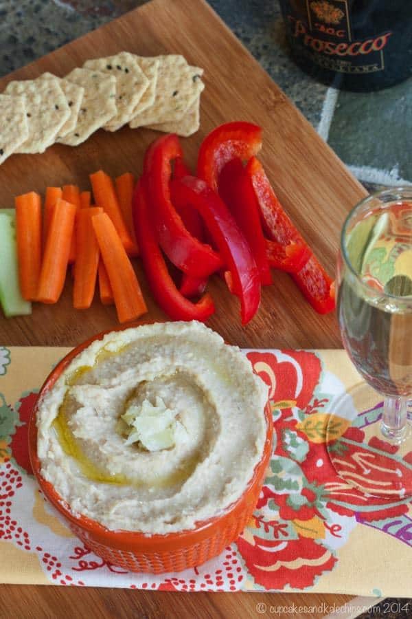 White Truffle Parmesan White Bean Hummus is a simple but luxurious party appetizer. You only need four ingredients and five minutes to make this delicious dip! | cupcakesandkalechips.com | gluten free, vegetarian