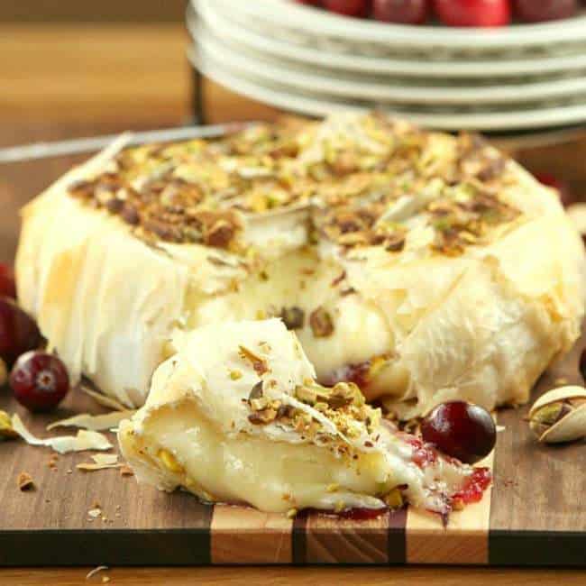 Cranberry Pistachio Stuffed Brie Wrapped in Phyllo - pin it to your Appetizer Board, because every party needs ooey gooey cheese! | fooddonelight.com for cupcakesandkalechips.com 