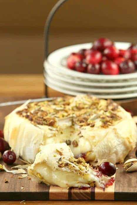 Cranberry Pistachio Stuffed Brie Wrapped in Phyllo - pin it to your Appetizer Board, because every party needs ooey gooey cheese! | fooddonelight.com for cupcakesandkalechips.com 