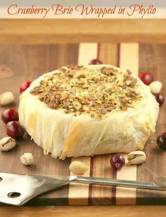 Cranberry Pistachio Stuffed Brie Wrapped in Phyllo - pin it to your Appetizer Board, because every party needs ooey gooey cheese! | fooddonelight.com for cupcakesandkalechips.com 