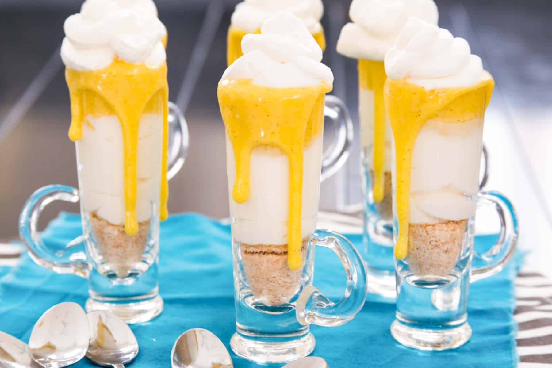 No-Bake Mini Creamsicle Cheesecake Parfaits are simple miniature desserts perfect for any spring holiday or party with a creamy cheesecake layer and the burst of citrus. Easy to make gluten free, too! | cupcakesandkalechips.com