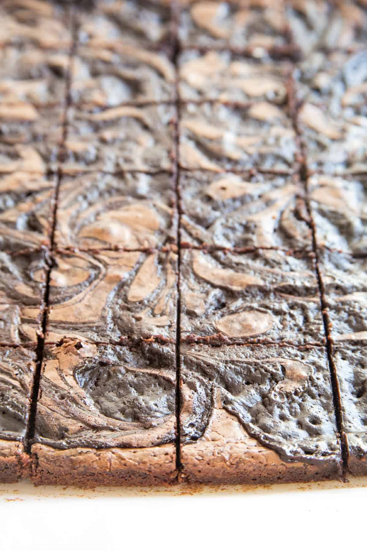 Sliced Bailey's Brownies on a piece of parchment paper