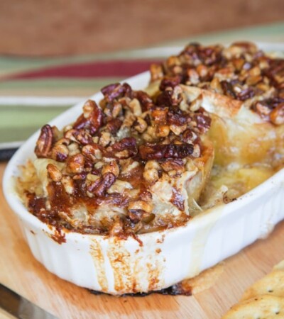 Melted brie cheese and honey nut topping oozes over baked bloomin' apples