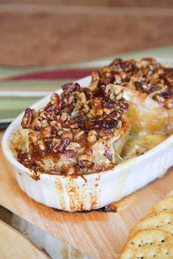 Melted brie cheese and honey nut topping oozes over baked bloomin' apples