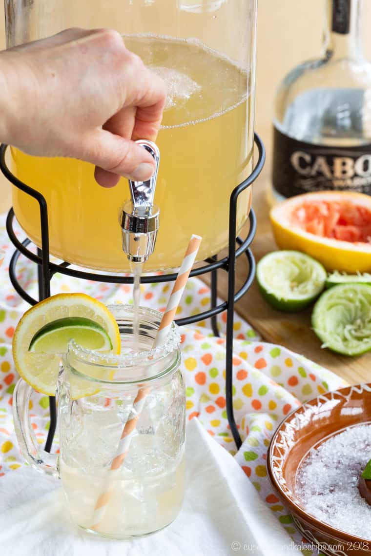 Filling a glass from a pitcher of Skinny Grapefruit Margaritas