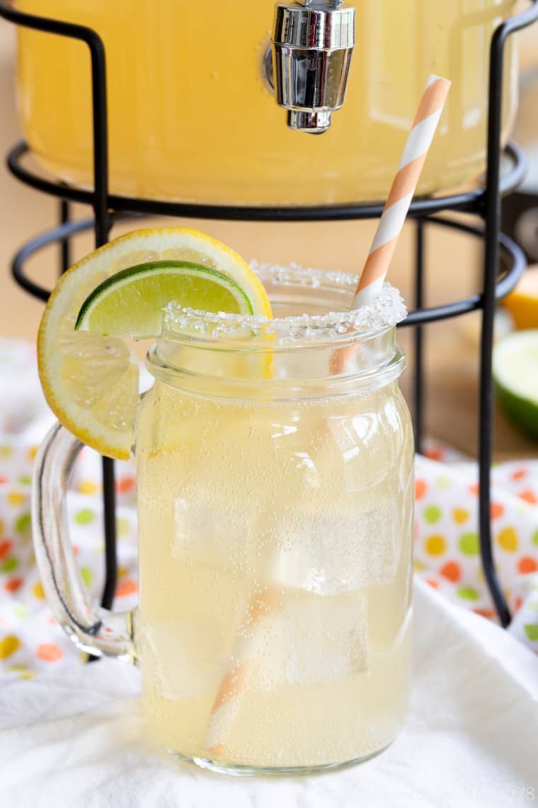 Low Calorie Grapefruit Margarita in a jar with coarse sugar on the rim