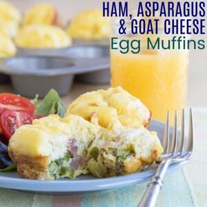 Cheesy Ham Asparagus Egg Muffin Cups on a plate with a piece cut off of one