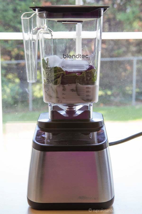 Blendtec blender filled with ingredients for a Cherry Vanilla Almond Smoothie