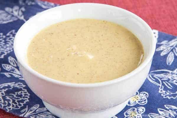 Small white bowl of honey mustard