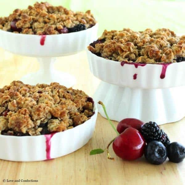 Gluten Free Blackberry, Blueberry and Cherry Crisp - Farmer’s market fresh fruits combine with a crunchy almond and oat crumb topping to make an easy Summer dessert | loveandconfections.com for cupcakesandkalechips.com