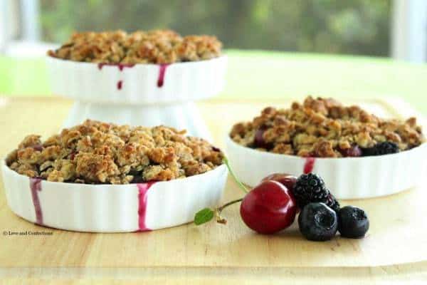 Gluten Free Blackberry, Blueberry and Cherry Crisp - Farmer’s market fresh fruits combine with a crunchy almond and oat crumb topping to make an easy Summer dessert | loveandconfections.com for cupcakesandkalechips.com