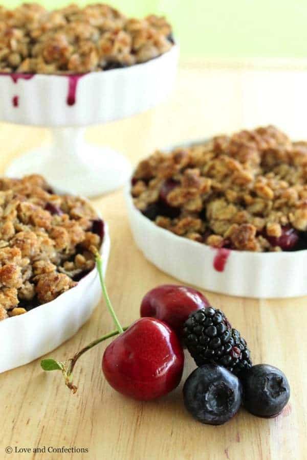 Gluten Free Blackberry, Blueberry and Cherry Crisp - Farmer’s market fresh fruits combine with a crunchy almond and oat crumb topping to make an easy Summer dessert | loveandconfections.com for cupcakesandkalechips.com