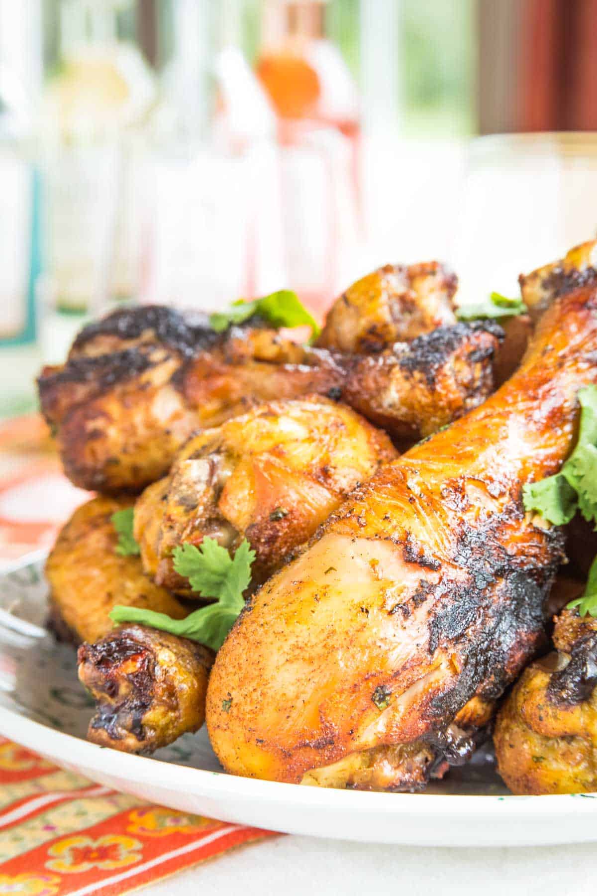 Closeup of juicy chicken drumsticks with Indian spices