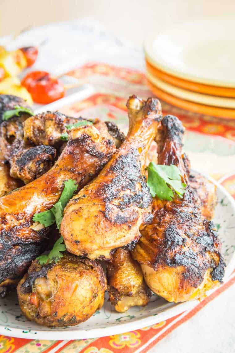 indian style chicken legs piled on a plate