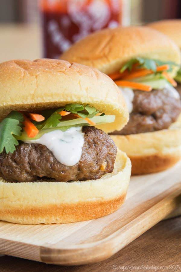 Closeup of a Mini Asian Burger with Thai flavors and Sriracha Lime cream sauce on top