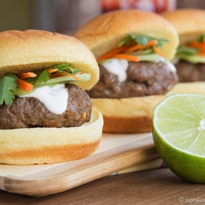 A row of Thai Sliders on a wooden platter