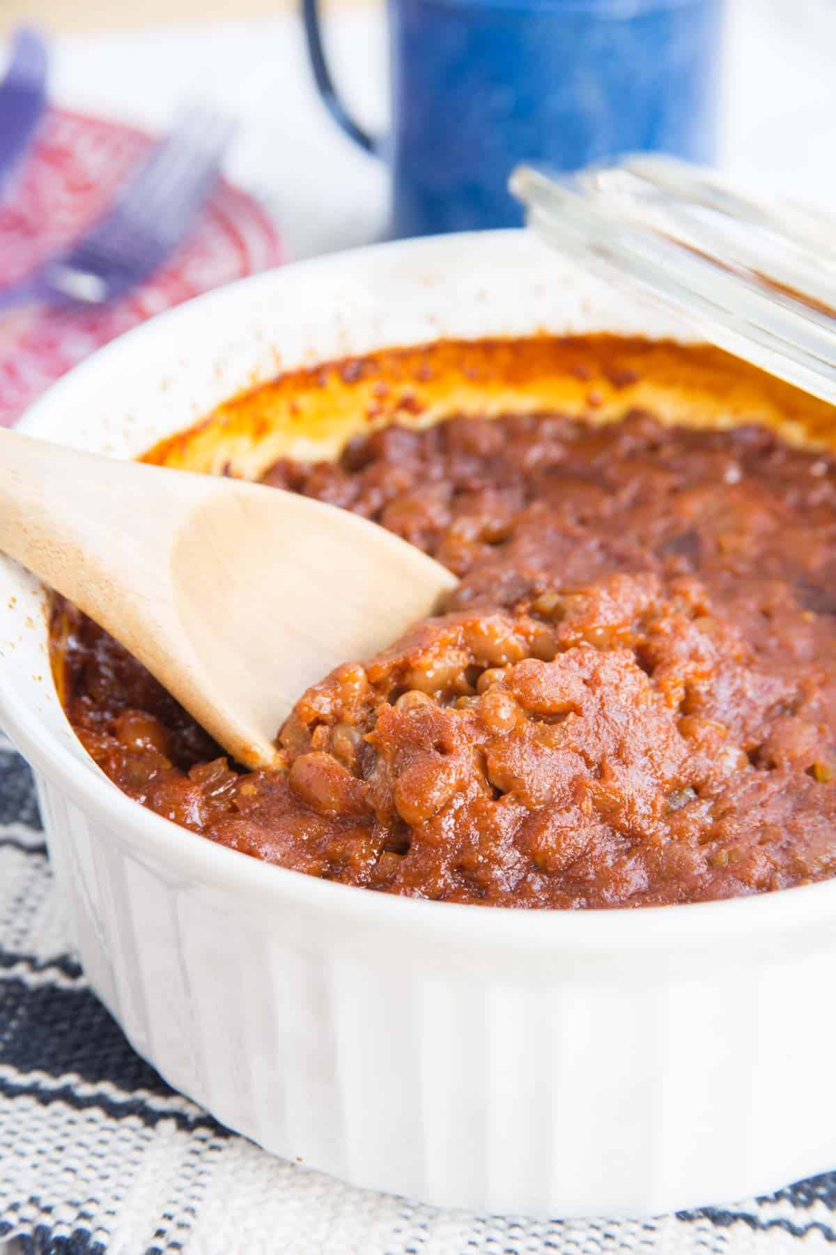 Scooping Semi-Homemade Baked Beans with a spoon