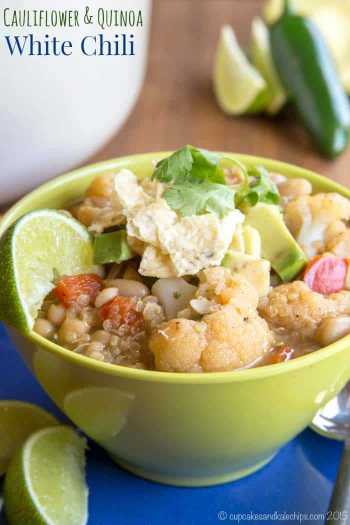 A bowl of quinoa chili garnished with a lime wedge.