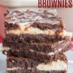 A closeup of three stacked brownies with text overlay that says "Flourless Cheesecake Brownies".