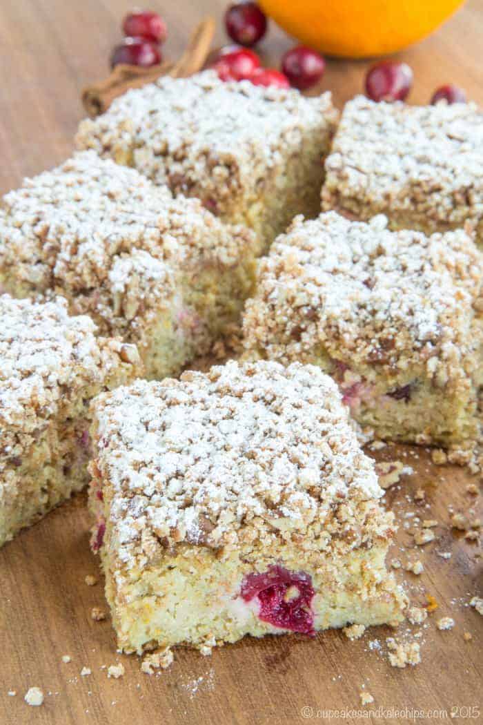 square slices of Gluten Free Cranberry Orange Cake on a cutting board