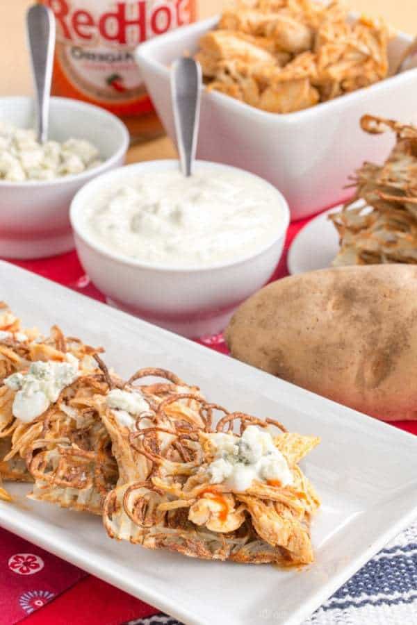 Buffalo Chicken Poutine on Potato Waffles - a fun and spicy version of the usual loaded French fries is great for dinner or snacking during the big game! | cupcakesandkalechips.com 