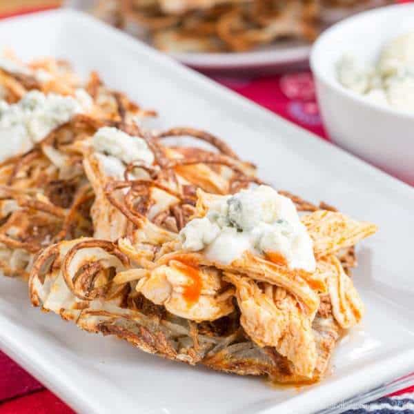 Buffalo Chicken Poutine on Potato Waffles - a fun and spicy version of the usual loaded French fries is great for dinner or snacking during the big game! | cupcakesandkalechips.com 