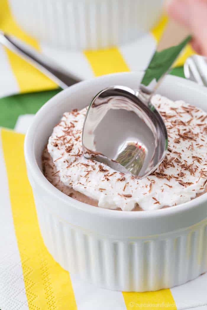 a spoon in ramekin of gluten free chocolate cream pie.