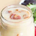 Top of a jar with Warm Bacon Dressing and bacon pieces on top