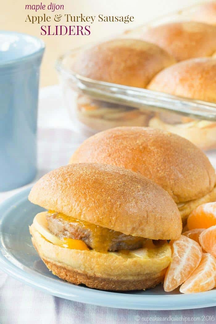 Apple turkey sausage breakfast sliders on a plate next to clementine wedges.
