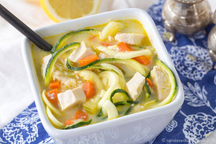 A white bowl of low carb Greek Chicken Zoodles Soup