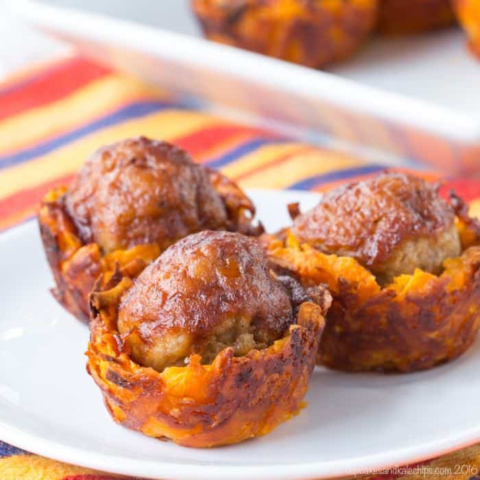 Three Cheesy Sweet Potato BBQ Meatball Bites on a white plate.