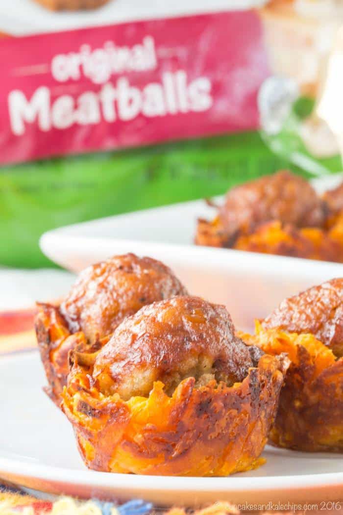 Close up of Cheesy Sweet Potato BBQ Meatball Bites with a bag of frozen meatballs in the background.