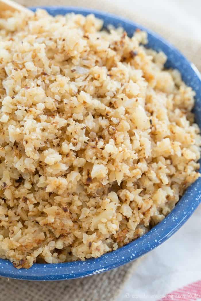 Closeup of Buttery Riced Cauliflower in a blue bowl