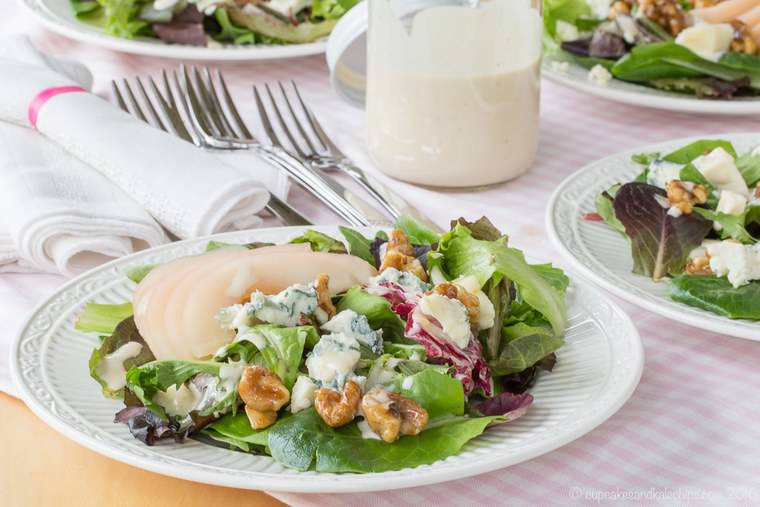 Italian Country Salad with poached pears, walnuts, and blu cheese on a decorative plate
