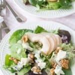 Two side salads with poached pears and blue cheese