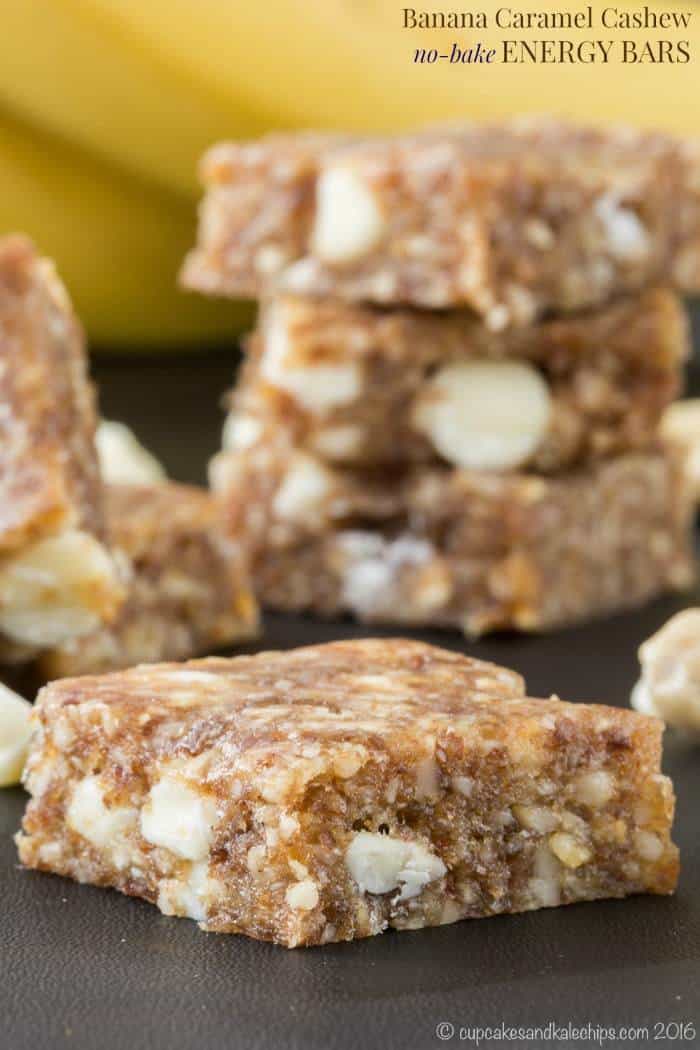 A no-bake energy bar in the foreground with a stack of bars in the background.