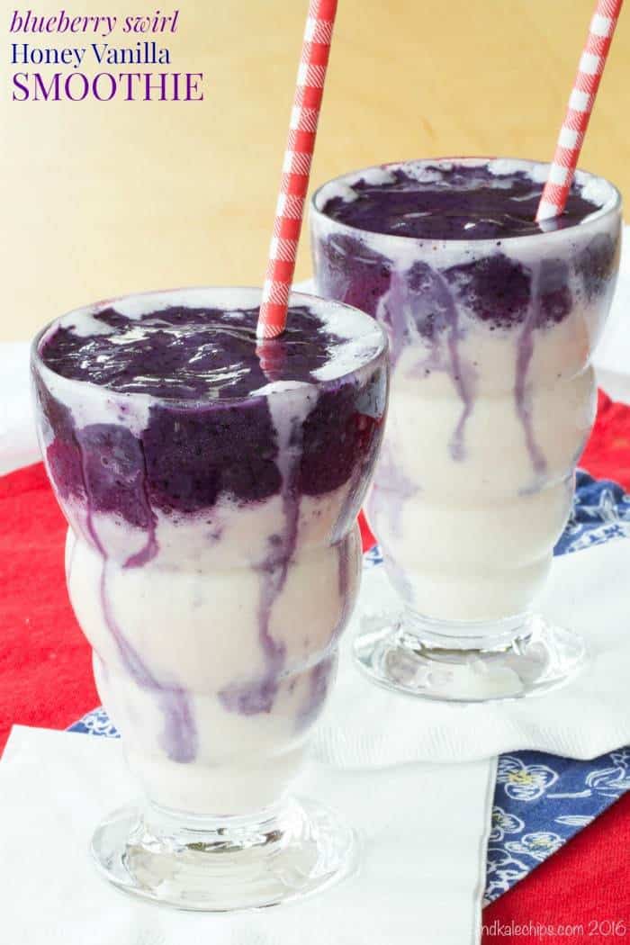 Two Honey and Vanilla Swirled Blueberry Smoothies side by side with red and white striped straws.