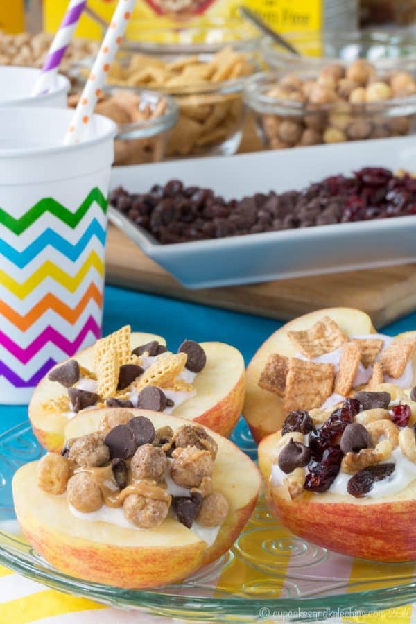 How to Make Cereal and Yogurt Stuffed Apples for a fun and nutritious after-school snack. Try these eight tasty combos or come up with your favorite, with gluten free, nut free, and peanut free options. #ad | cupcakesandkalechips.com