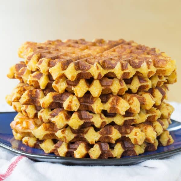 Cheesy Polenta Waffles - this savory waffle recipe makes a delicious side dish any time you'd serve polenta or even cheddar grits, or serve it for breakfast topped with eggs. | cupcakesandkalechips.com | gluten free