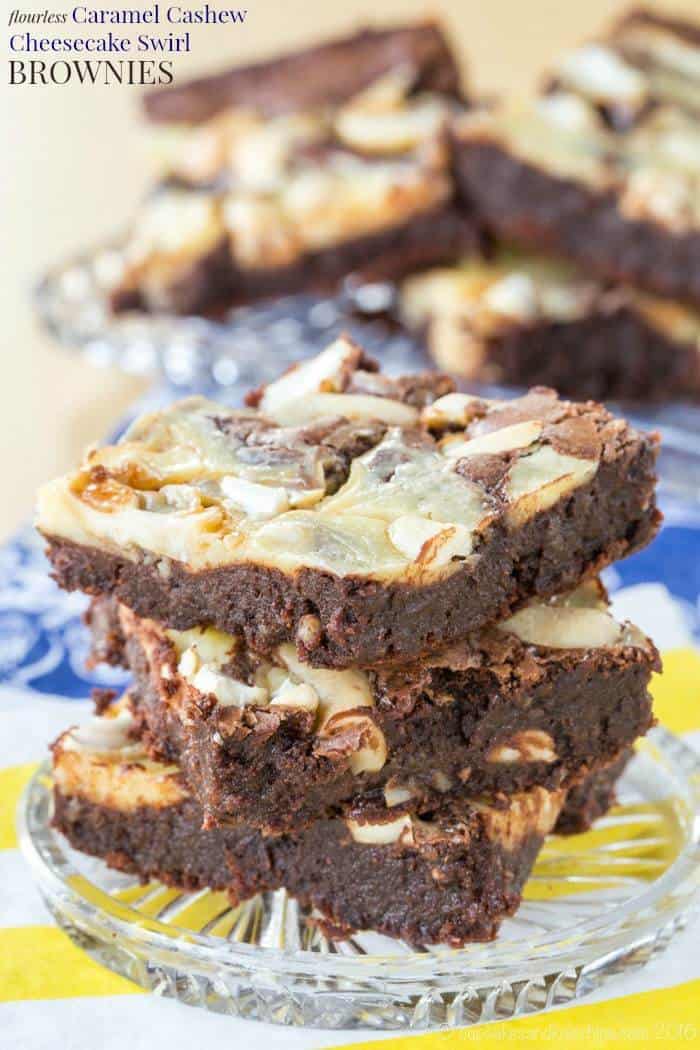 Stack of fudgy caramel cashew brownies on a plate.