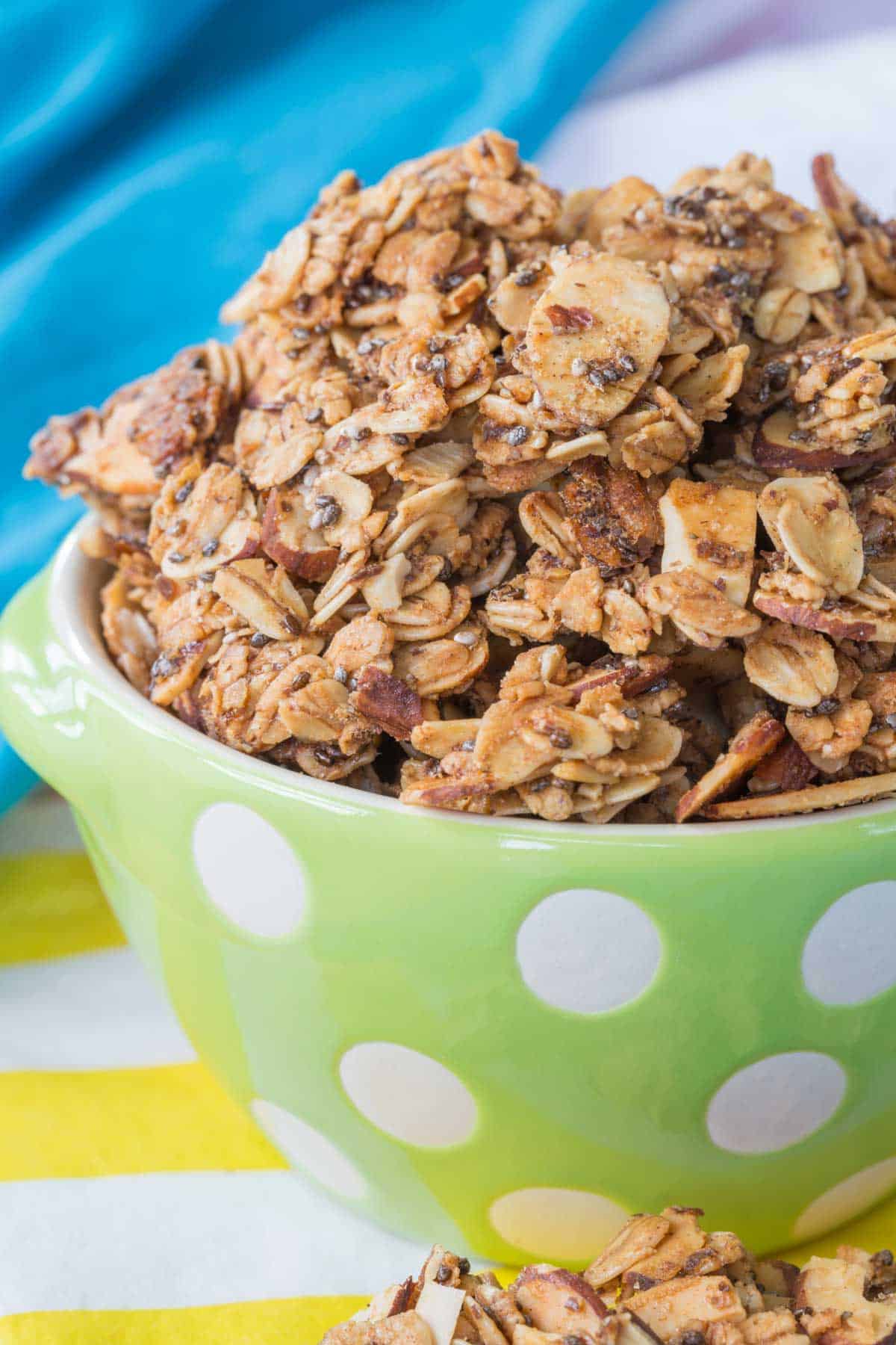 granola clusters in a green polka dot bowl.