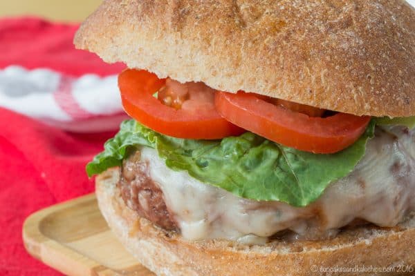 Meatball Parmesan Burgers - transform the classic Italian comfort food recipe into a juicy hamburger topped with tomato sauce and cheese. | cupcakesandkalechips.com