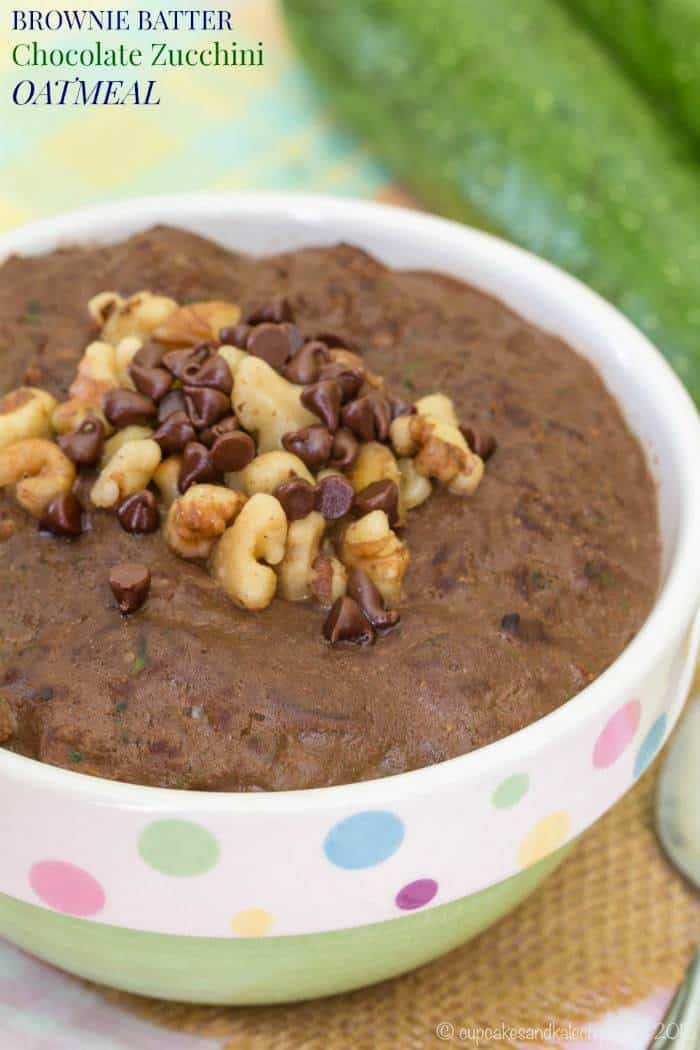 A bowl of zucchini oatmeal stopped with crushed nuts and chocolate chips.