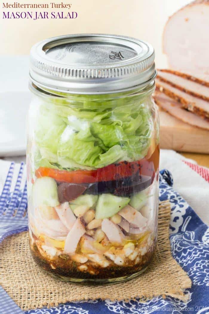 Mediterranean Turkey Mason Jar Salad - layer a simple salad dressing, feta cheese, turkey, veggies, and more for an easy and portable lunch recipe with @jennieorecipes. Gluten free and low carb. #ad | cupcakesandkalechips.com