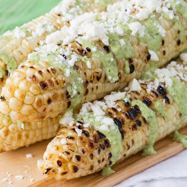 Peruvian-Style Grilled Street Corn - corn on the cob slathered with fresh and spicy Aji sauce and cheese is an easy summer side dish recipe! Gluten free | cupcakesandkalechips.com