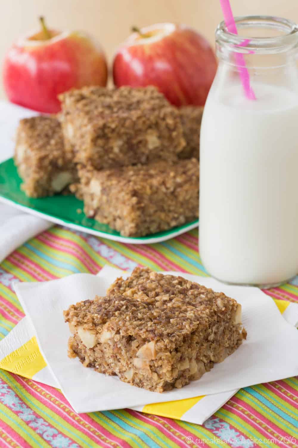 Cinnamon Apple Quinoa Breakfast Bar on a napkin with a glass of milk