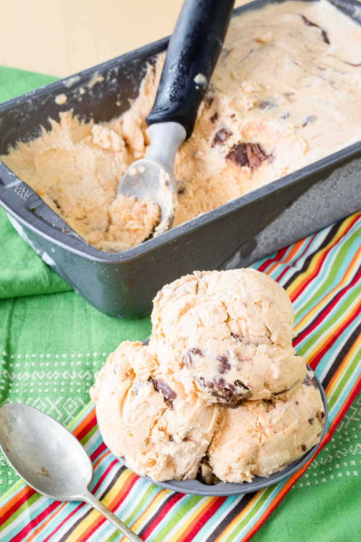 No-Churn Pumpkin Nutella Swirl Ice Cream scooped from a pan into a dish