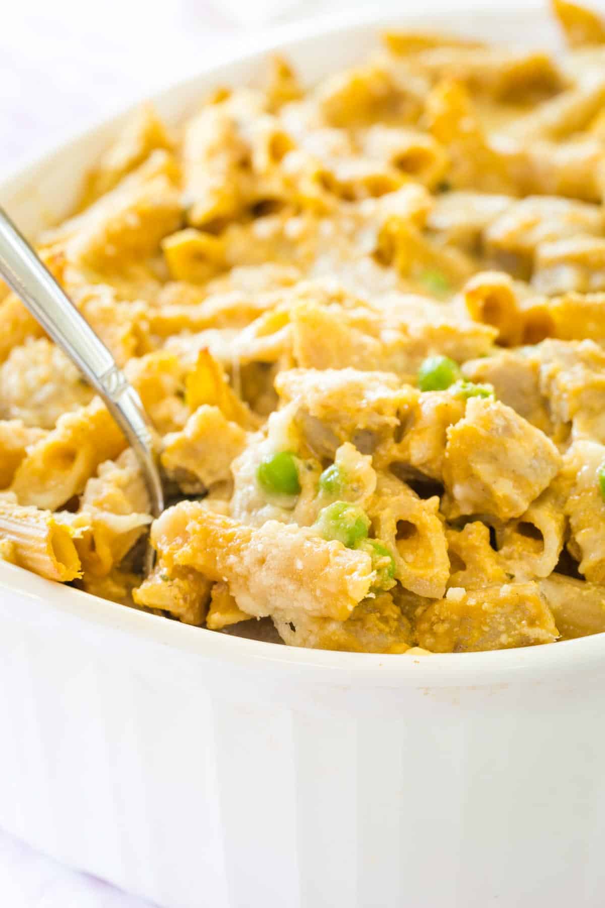 Baked pumpkin penne is served from a baking dish.