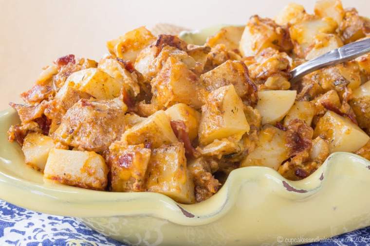 Cheesy roasted potatoes piled in a serving bowl