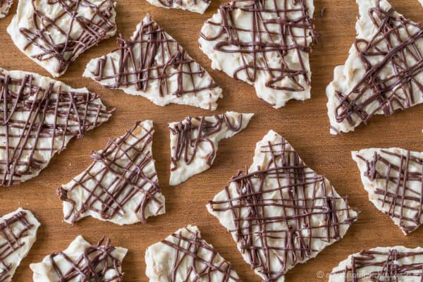 Pumpkin Spice Toffee Chocolate Bark pieces on a cutting board